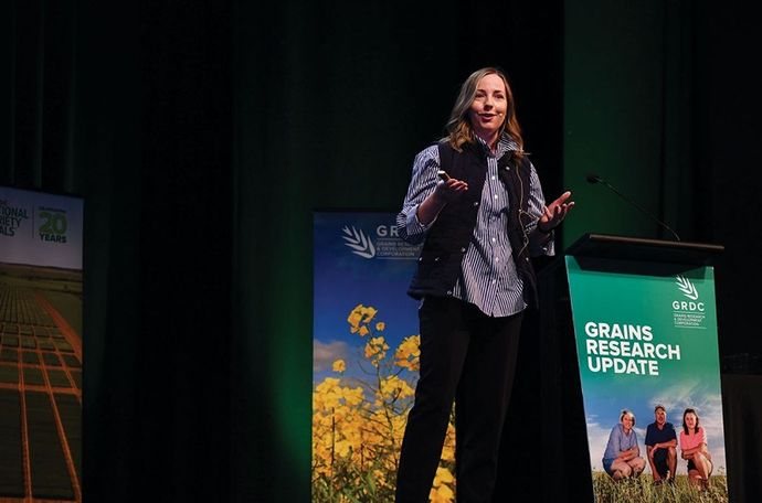 Courtney Bailey presenting at the GDRC conference about the importance of sustainable community trust